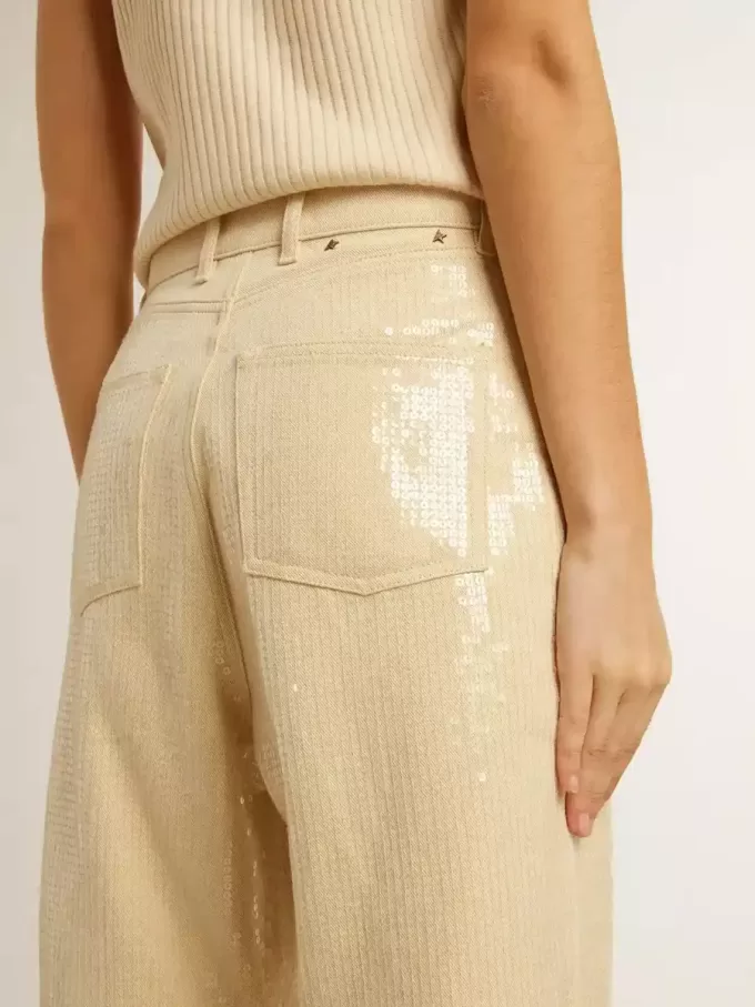 Pantalones crudo con lentejuelas transparentes por toda la prenda Pantalones crudo con lentejuelas transparentes por toda la prenda