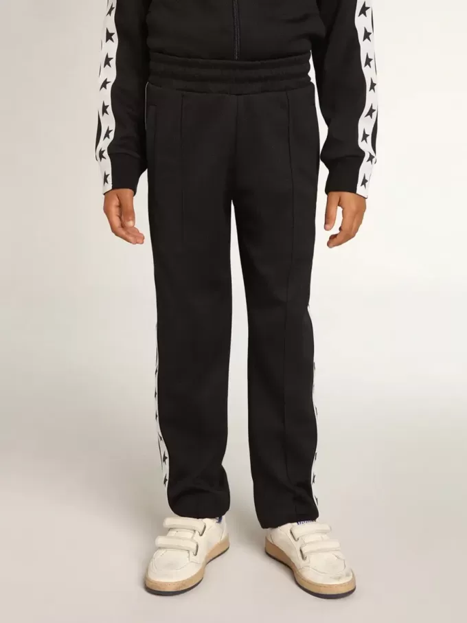 Pantalones de chándal azul oscuro con franja blanca y estrellas en contraste Pantalones de chándal azul oscuro con franja blanca y estrellas en contraste