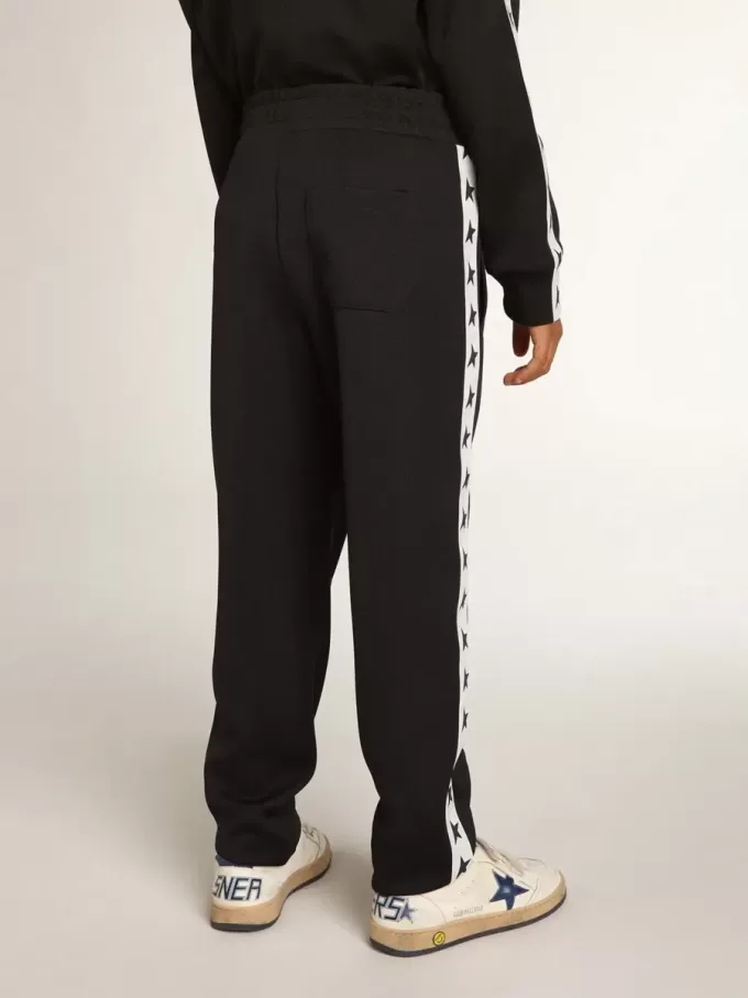 Pantalones de chándal azul oscuro con franja blanca y estrellas en contraste Pantalones de chándal azul oscuro con franja blanca y estrellas en contraste