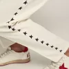 Pantalones de chándal blancos para hombre con estrellas negras en los laterales Pantalones de chándal blancos para hombre con estrellas negras en los laterales