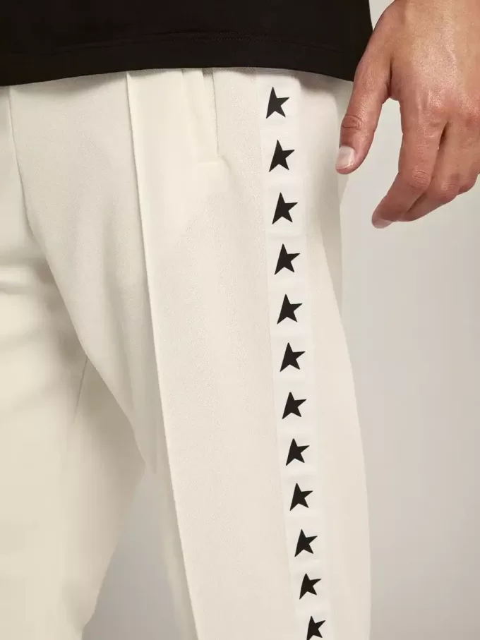 Pantalones de chándal blancos para hombre con estrellas negras en los laterales Pantalones de chándal blancos para hombre con estrellas negras en los laterales