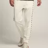 Pantalones de chándal blancos para hombre con estrellas negras en los laterales Pantalones de chándal blancos para hombre con estrellas negras en los laterales