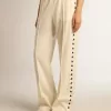 Pantalones de chándal blancos para mujer con estrellas en los laterales Pantalones de chándal blancos para mujer con estrellas en los laterales