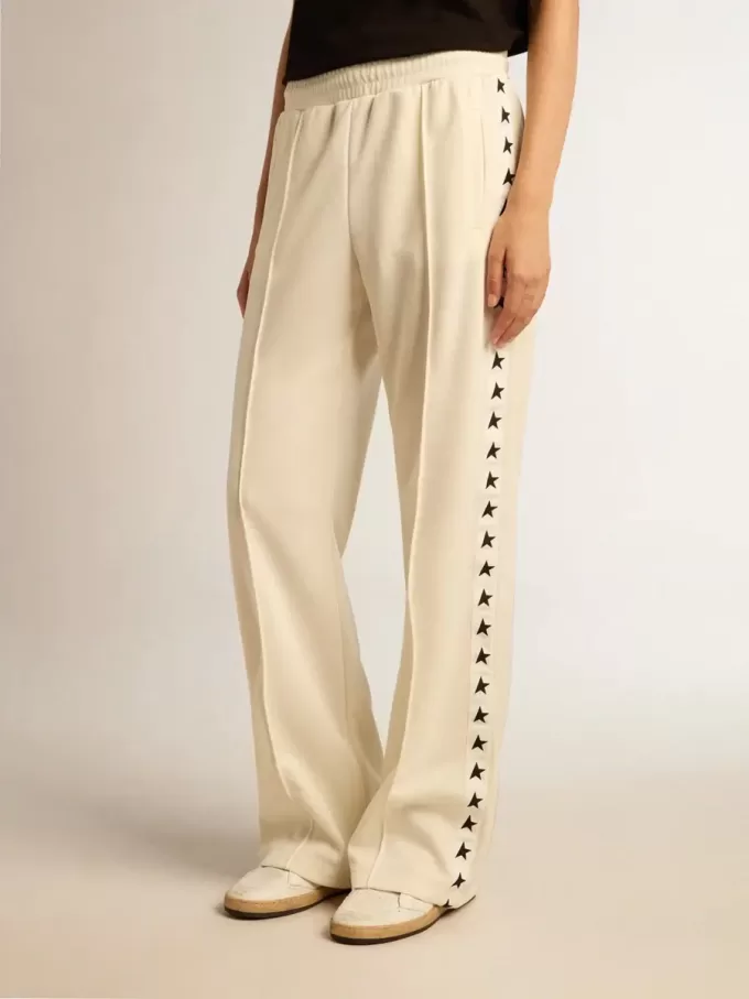 Pantalones de chándal blancos para mujer con estrellas en los laterales Pantalones de chándal blancos para mujer con estrellas en los laterales