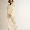 Pantalones de chándal blancos para mujer con estrellas en los laterales Pantalones de chándal blancos para mujer con estrellas en los laterales