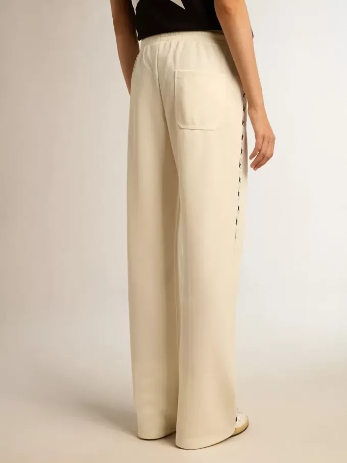 Pantalones de chándal blancos para mujer con estrellas en los laterales Pantalones de chándal blancos para mujer con estrellas en los laterales