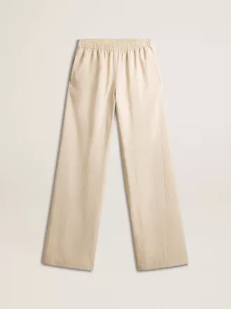 Pantalones de chándal de seda y viscosa beige claro para mujer.