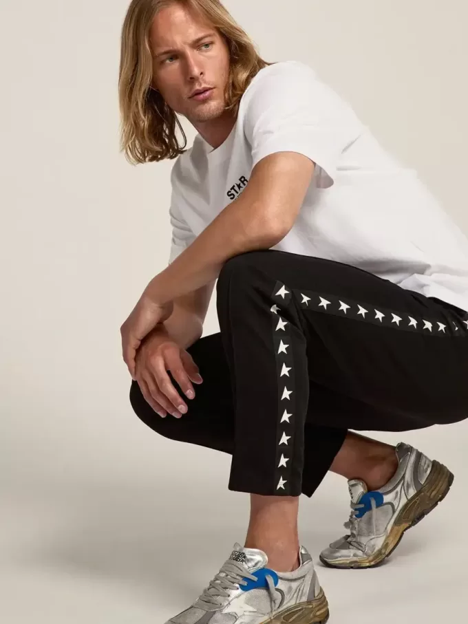 Pantalones de chándal negros para hombre con estrellas blancas en los laterales Pantalones de chándal negros para hombre con estrellas blancas en los laterales