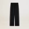 Pantalones de chándal negros para mujer con estrellas blancas en los laterales Pantalones de chándal negros para mujer con estrellas blancas en los laterales