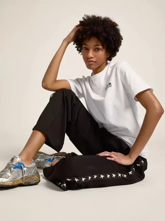 Pantalones de chándal negros para mujer con estrellas blancas en los laterales Pantalones de chándal negros para mujer con estrellas blancas en los laterales