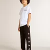 Pantalones de chándal negros para niño con estrellas blancas