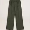 Pantalones de chándal para hombre en color verde oscuro con rayas verticales. Pantalones de chándal para hombre en color verde oscuro con rayas verticales.