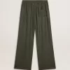 Pantalones de chándal para hombre en color verde oscuro con rayas verticales. Pantalones de chándal para hombre en color verde oscuro con rayas verticales.