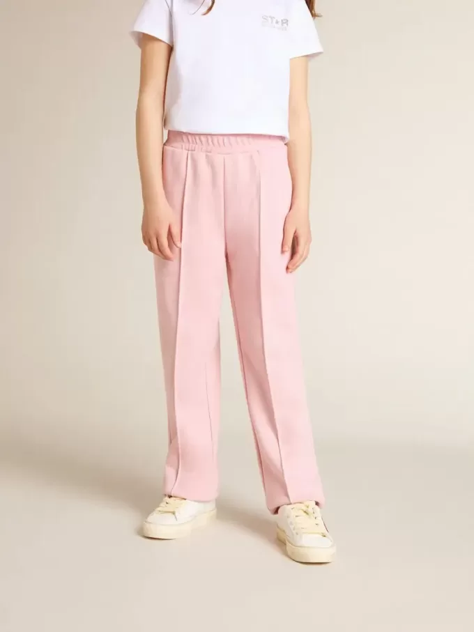 Pantalones de chándal rosas con estrella brillante en la parte delantera. Pantalones de chándal rosas con estrella brillante en la parte delantera.