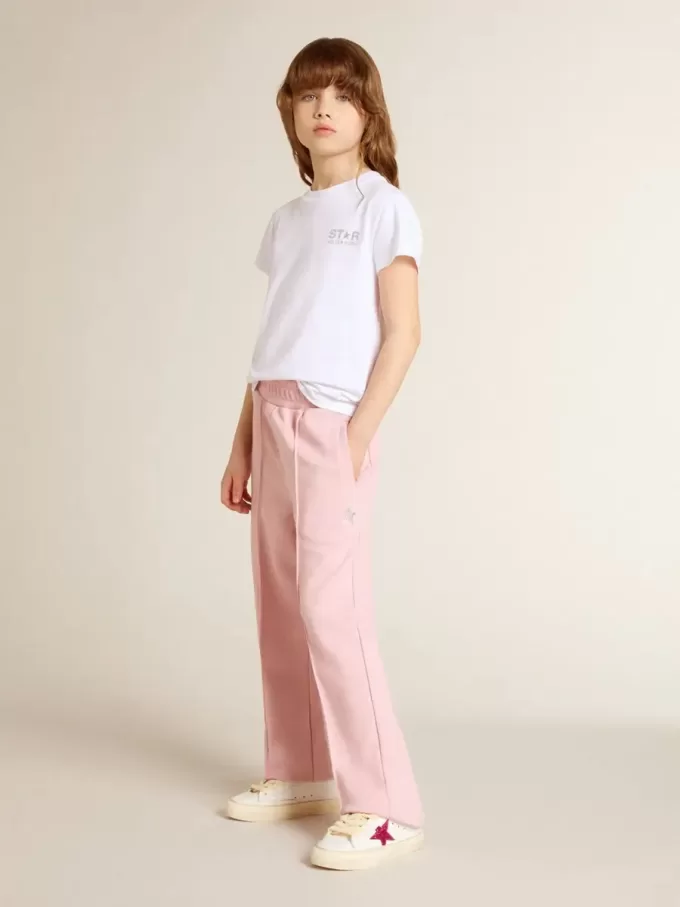Pantalones de chándal rosas con estrella brillante en la parte delantera. Pantalones de chándal rosas con estrella brillante en la parte delantera.