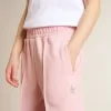 Pantalones de chándal rosas con estrella brillante en la parte delantera. Pantalones de chándal rosas con estrella brillante en la parte delantera.