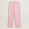 Pantalones de chándal rosas con estrella brillante en la parte delantera. Pantalones de chándal rosas con estrella brillante en la parte delantera.
