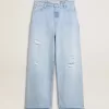 Pantalones de mujer en denim con efecto desgastado Pantalones de mujer en denim con efecto desgastado