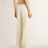 Pantalones holgados de mujer en tejido sastre blanco desgastado Pantalones holgados de mujer en tejido sastre blanco desgastado