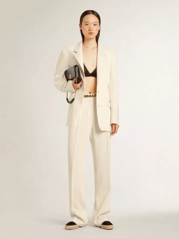 Pantalones holgados de mujer en tejido sastre blanco desgastado Pantalones holgados de mujer en tejido sastre blanco desgastado