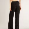 Pantalones joggers negros para mujer con estampado toile de jouy tono sobre tono Pantalones joggers negros para mujer con estampado toile de jouy tono sobre tono