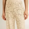 Pantalones transparentes de encaje color crema para mujer Pantalones transparentes de encaje color crema para mujer