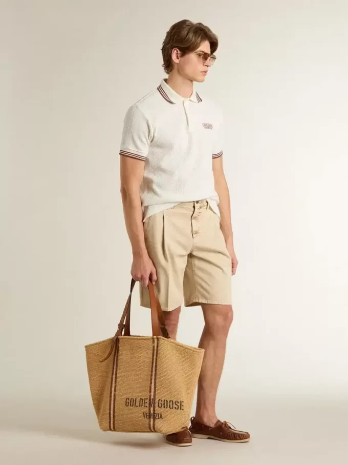 Polo de hombre en punto perforado blanco con detalles de rayas burdeos