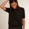 Polo de mujer en lana merino negra Polo de mujer en lana merino negra
