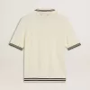 Polo de punto blanco desgastado para hombre con ribetes azules Polo de punto blanco desgastado para hombre con ribetes azules