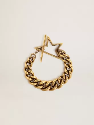 Pulsera con cadena decreciente en oro antiguo y cierre en forma de estrella Pulsera con cadena decreciente en oro antiguo y cierre en forma de estrella