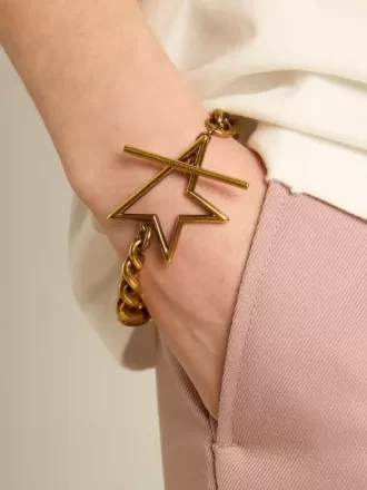 Pulsera con cadena decreciente en oro antiguo y cierre en forma de estrella Pulsera con cadena decreciente en oro antiguo y cierre en forma de estrella