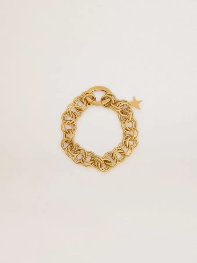 Pulsera de cadena tejida en color oro antiguo con cierre en forma de estrella Pulsera de cadena tejida en color oro antiguo con cierre en forma de estrella