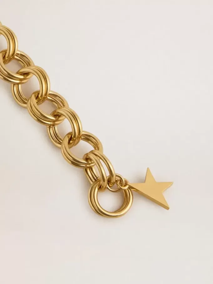 Pulsera de cadena tejida en color oro antiguo con cierre en forma de estrella Pulsera de cadena tejida en color oro antiguo con cierre en forma de estrella