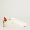 Purestar para hombre con estrella de cuero blanco y lengüeta naranja en el talón