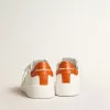 Purestar para hombre con estrella de cuero blanco y lengüeta naranja en el talón
