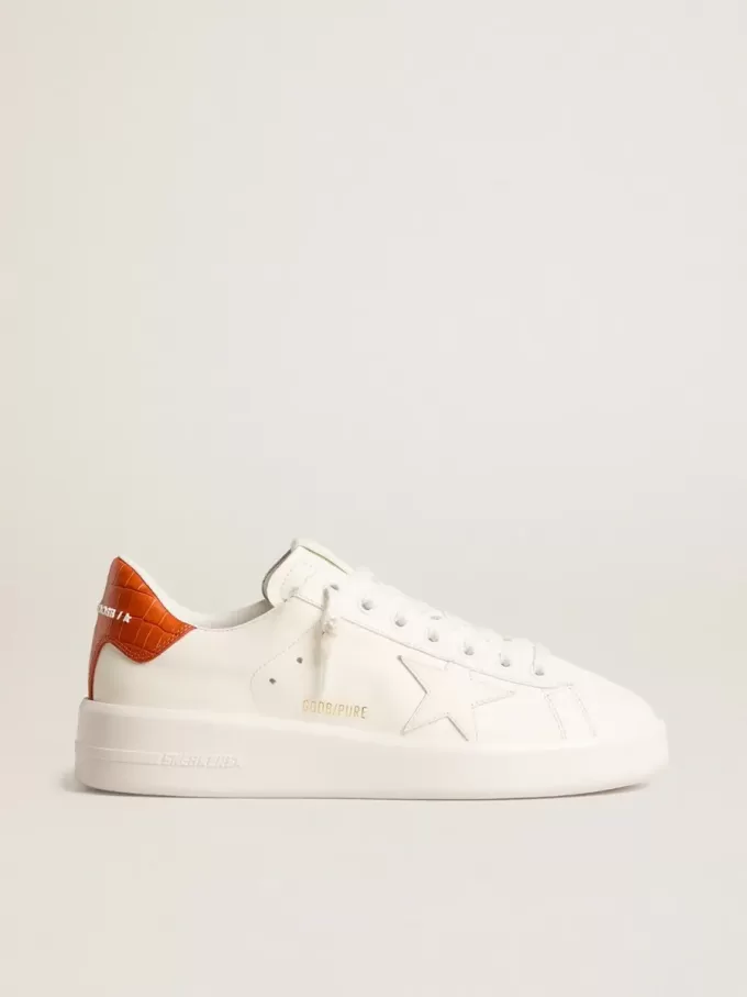 Purestar para mujer con estrella de cuero blanco y lengüeta naranja en el talón