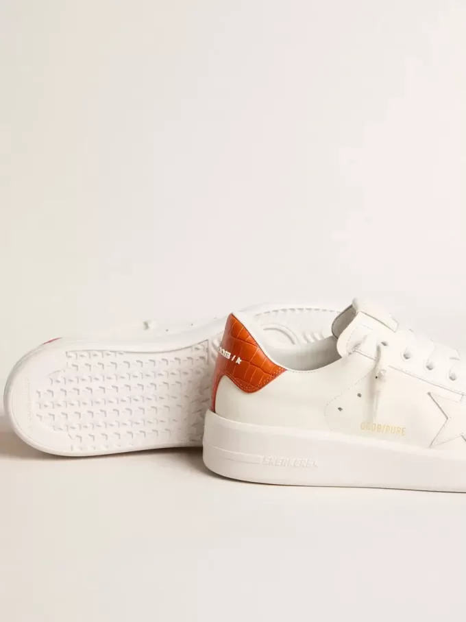 Purestar para mujer con estrella de cuero blanco y lengüeta naranja en el talón