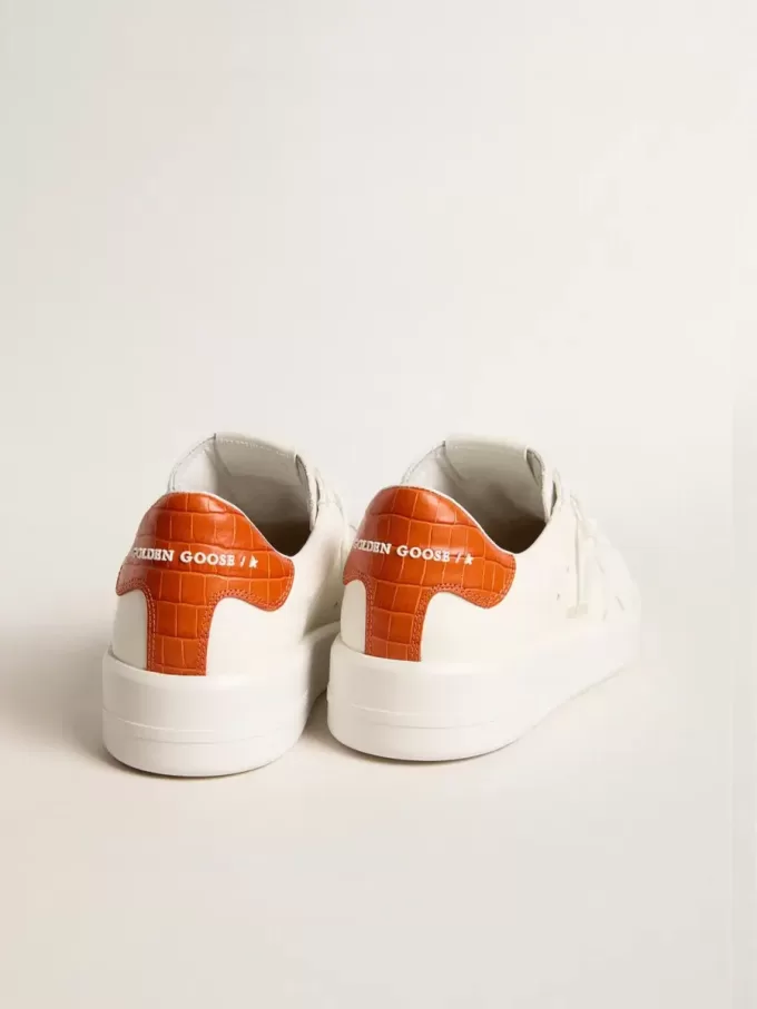 Purestar para mujer con estrella de cuero blanco y lengüeta naranja en el talón