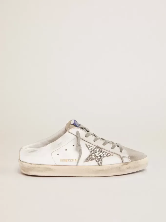 Sabot Super-Star con estrella brillante de platino y lengüeta de ante. Sabot Super-Star con estrella brillante de platino y lengüeta de ante.