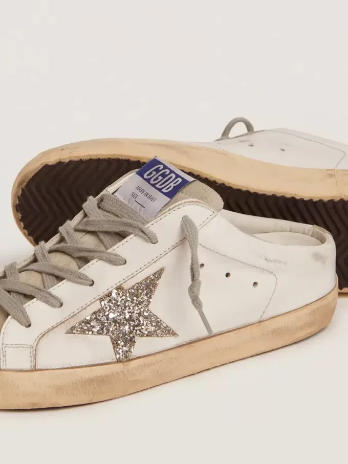 Sabot Super-Star con estrella brillante de platino y lengüeta de ante. Sabot Super-Star con estrella brillante de platino y lengüeta de ante.