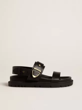 Sandalia Lucy para mujer en piel negra brillante con hebilla metálica dorada