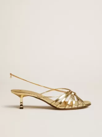 Sandalias Nico con tacón bajo en piel metalizada dorada