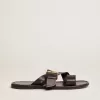 Sandalias planas Margaret para mujer en piel negra recubierta de resina Sandalias planas Margaret para mujer en piel negra recubierta de resina