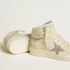 Sky-Star para mujer en piel con estrella de piel azul claro y lengüeta blanca en el talón. Sky-Star para mujer en piel con estrella de piel azul claro y lengüeta blanca en el talón.