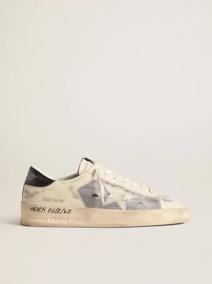 Stardan en piel blanca y malla con estrella de piel blanca. Stardan en piel blanca y malla con estrella de piel blanca.