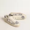 Stardan en piel blanca y malla con estrella de piel blanca. Stardan en piel blanca y malla con estrella de piel blanca.