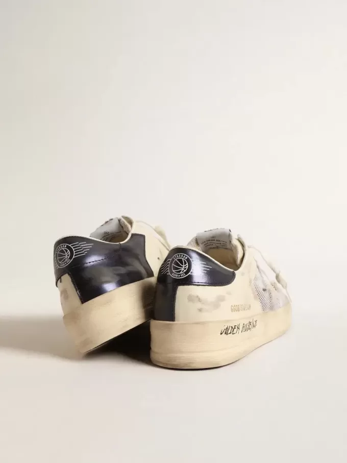 Stardan en piel blanca y malla con estrella de piel blanca. Stardan en piel blanca y malla con estrella de piel blanca.