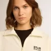 Sudadera blanca con cremallera para mujer con franja blanca y estrellas negras Sudadera blanca con cremallera para mujer con franja blanca y estrellas negras
