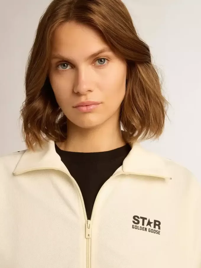 Sudadera blanca con cremallera para mujer con franja blanca y estrellas negras Sudadera blanca con cremallera para mujer con franja blanca y estrellas negras