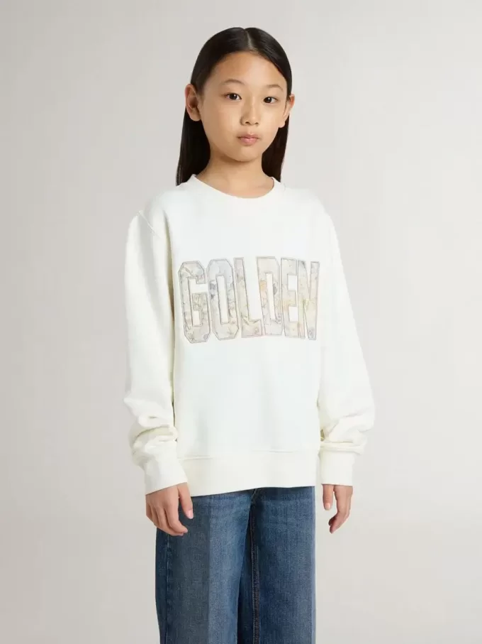 Sudadera blanca para niña con inscripción multicolor «Golden» en la parte delantera Sudadera blanca para niña con inscripción multicolor «Golden» en la parte delantera